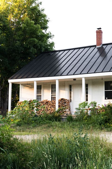 metal roof on a ranch style house|white farmhouse with metal roof.